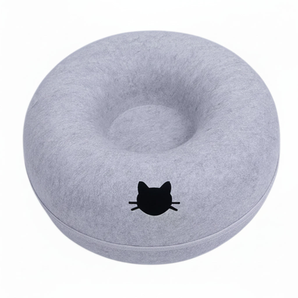 Gray donut-shaped cushion with a black cat design on a white background