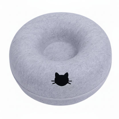 Gray donut-shaped cushion with a black cat design on a white background